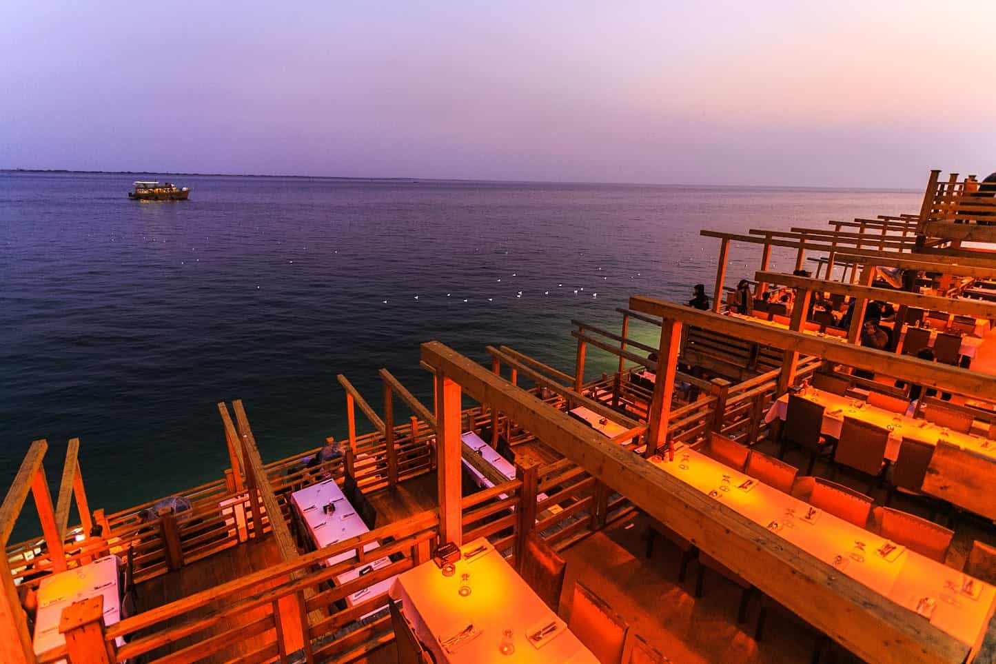 Sea-facing deck at Do Darya at dusk