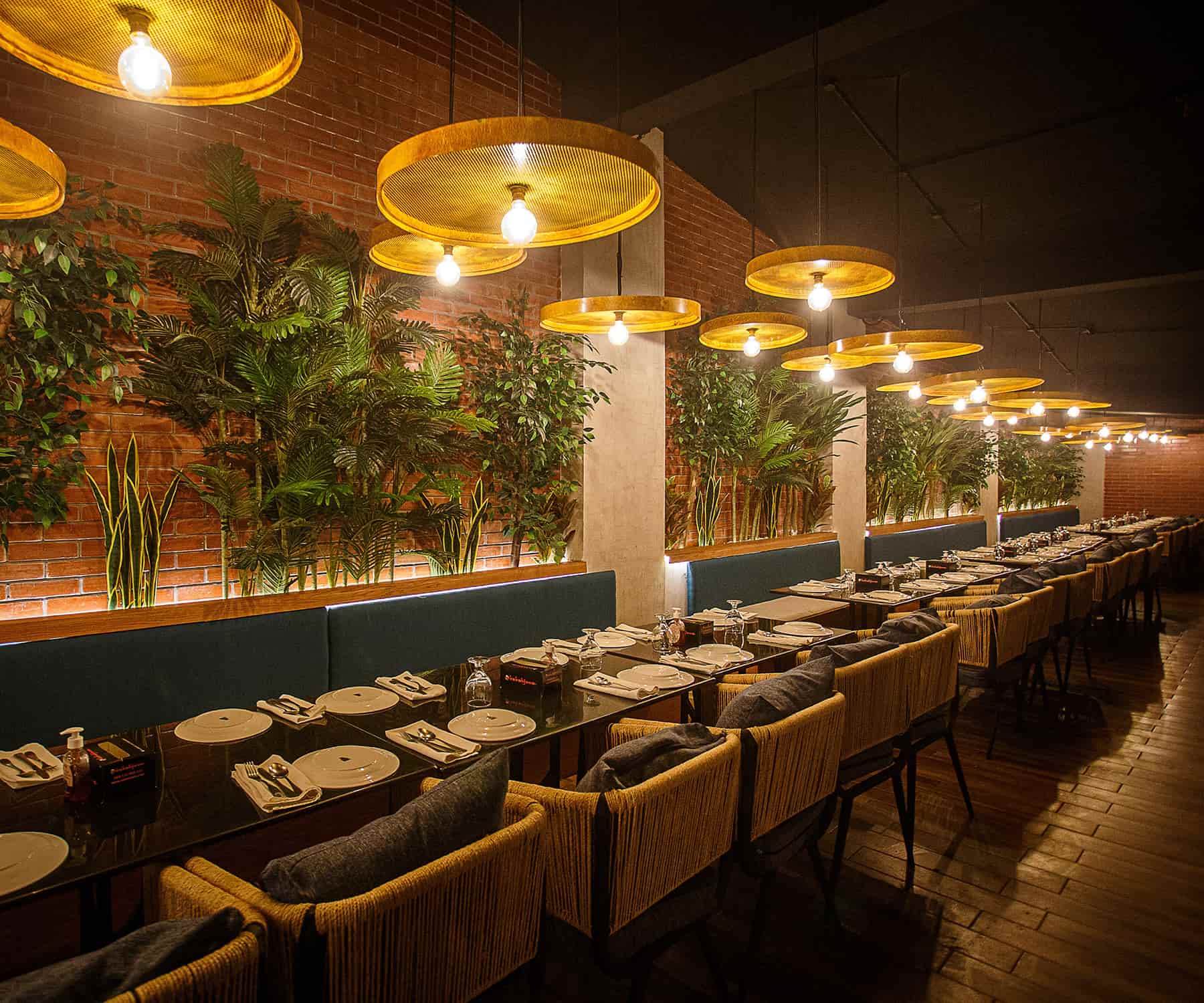 Kababjees Shaheed-e-Millat dining hall under brass pendant lamps