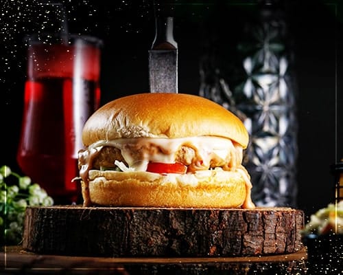 Stacked burger on a wooden board