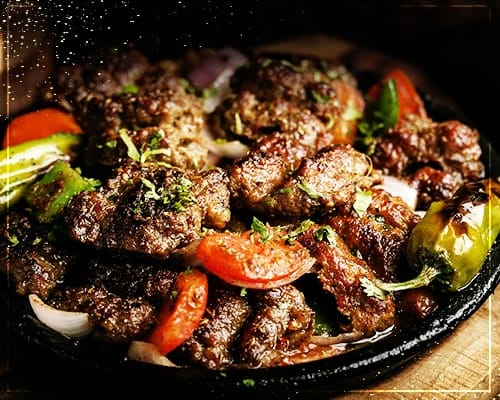 Beef boti with grilled tomatoes and peppers