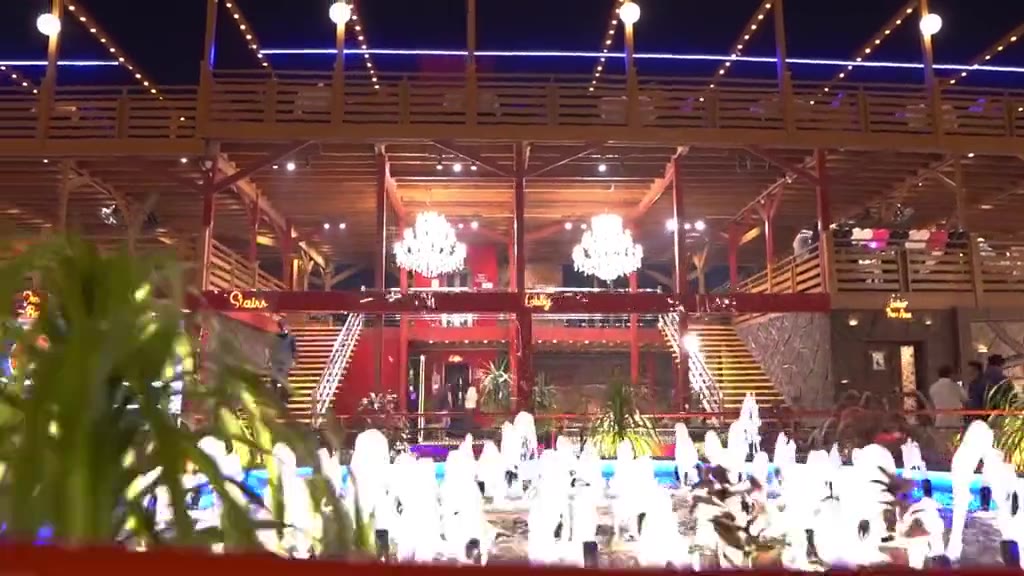 Red pavilion with chandeliers and fountains